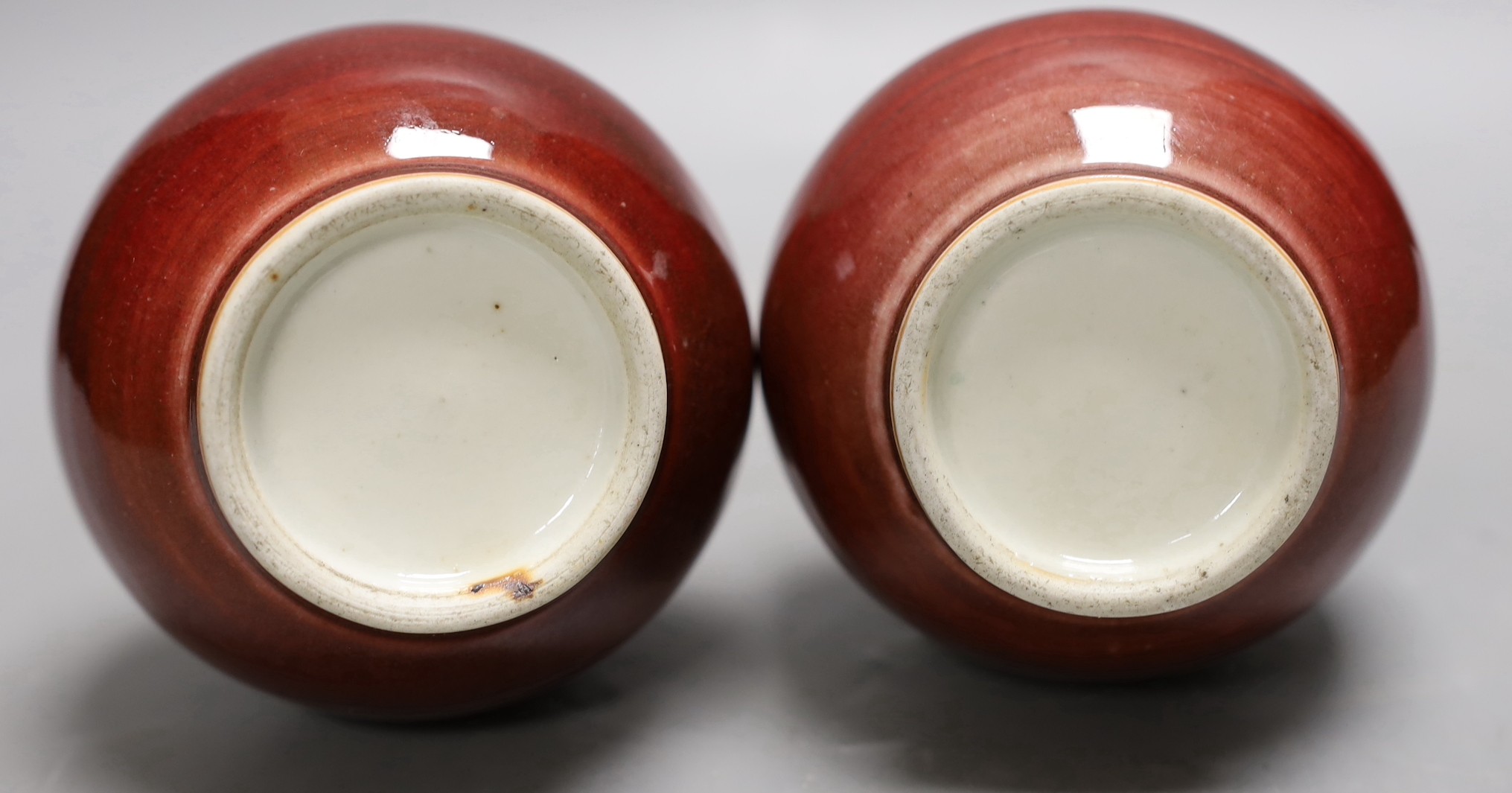 A pair of Chinese sang de boeuf glazed vases, early 20th century, 20cm high